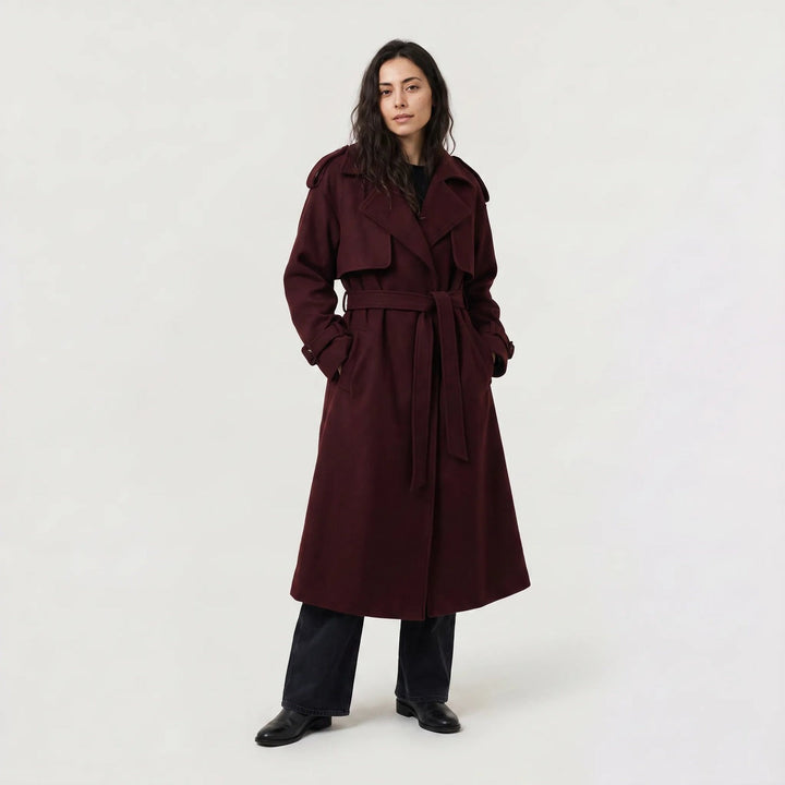 Long trench coat with tie belt in burgundy, worn