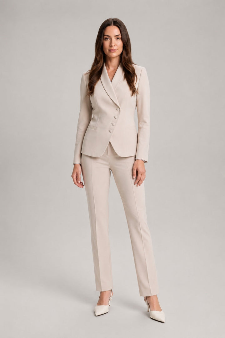 Trouser suit with asymmetric wrap blazer and straight trousers in beige, worn, front view