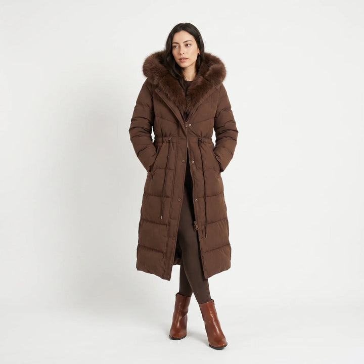 Long puffer coat with faux fur hood in brown, worn, full-length view
