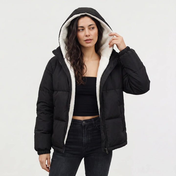 Hooded puffer jacket with sherpa fleece lining in black, worn, front view