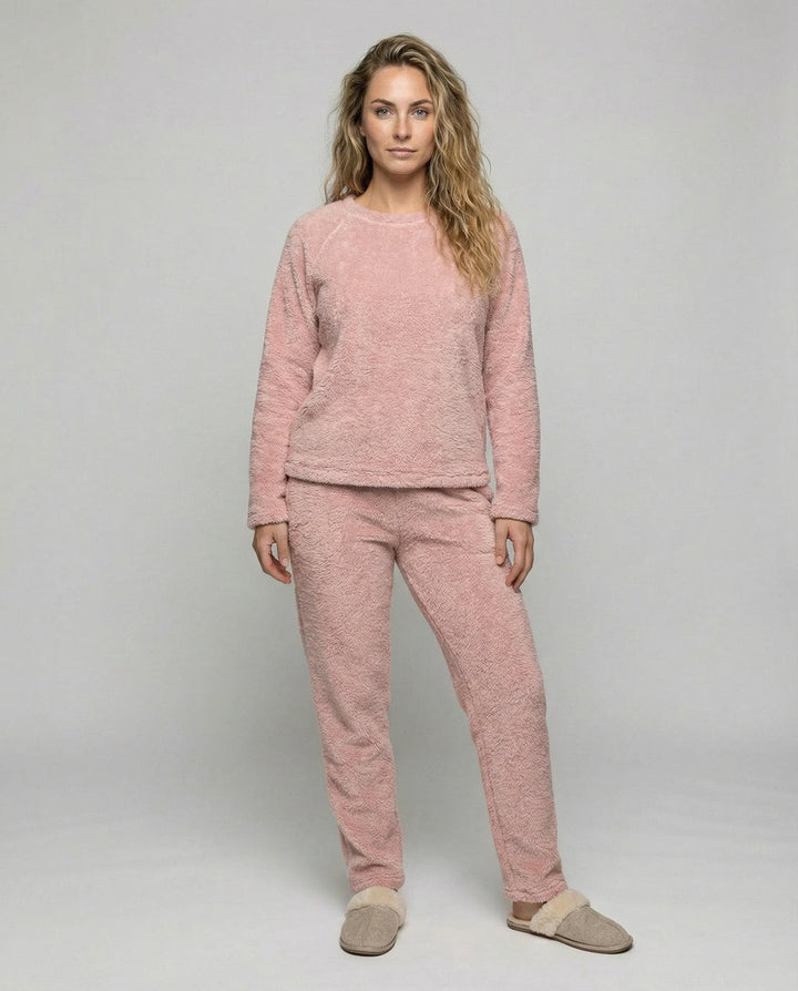 Pink fleece pyjamas with crew-neck raglan top and straight-leg trousers, worn, front view