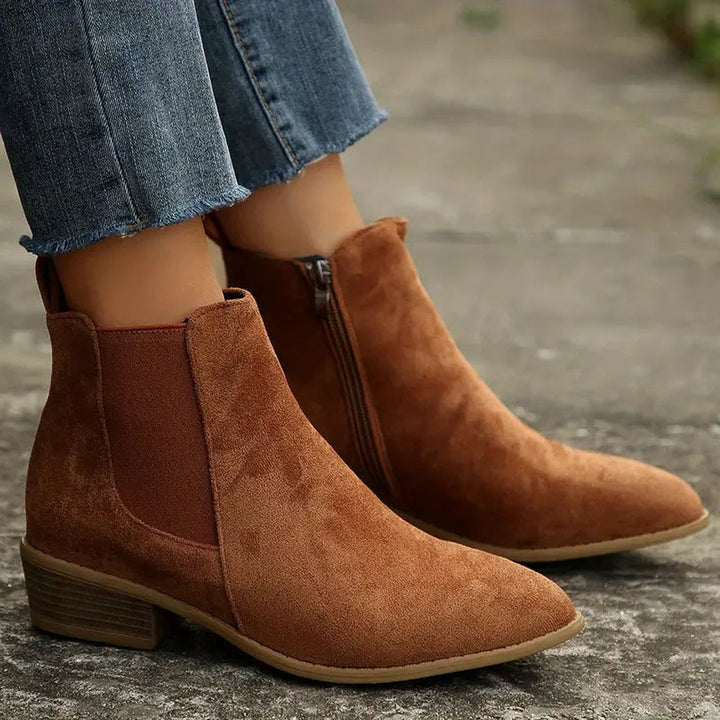 Brown suede-look Chelsea boots with stacked heel, worn with jeans