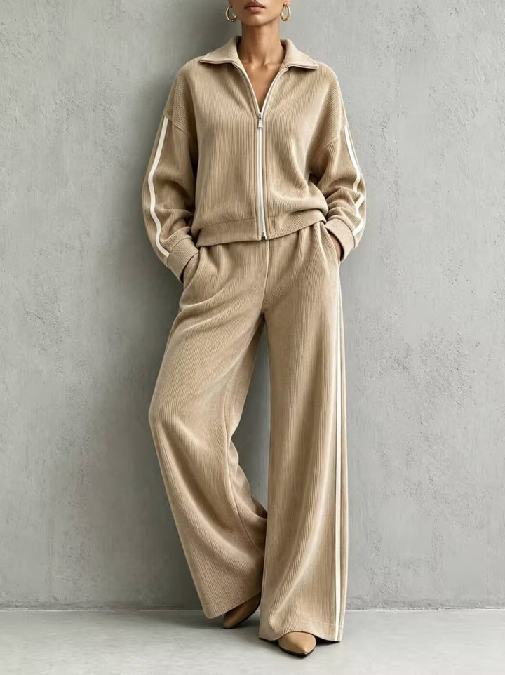 Beige ribbed lounge set with zip-up jacket and side-stripe wide-leg trousers, front view, hands in the pockets