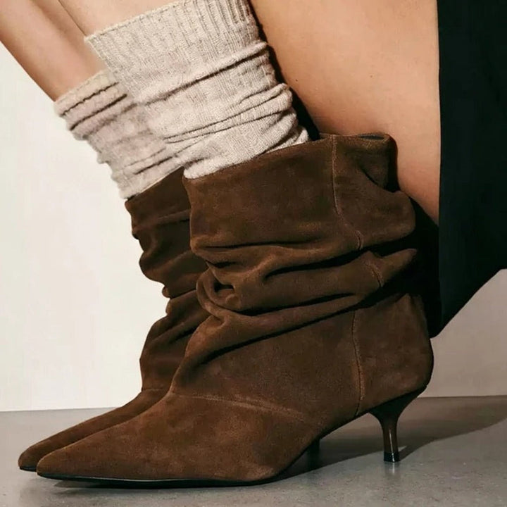 Brown slouch ankle boots with kitten heel, worn with socks