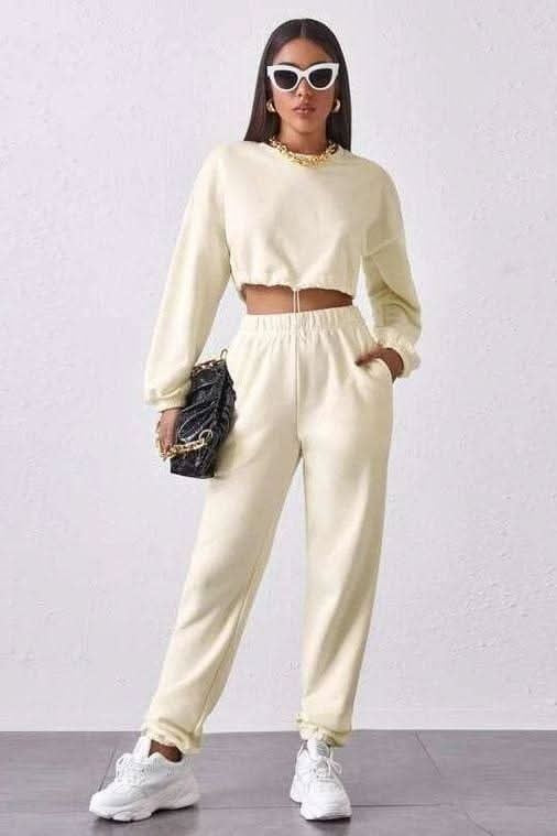 Cream cropped sweatshirt and joggers set, front view