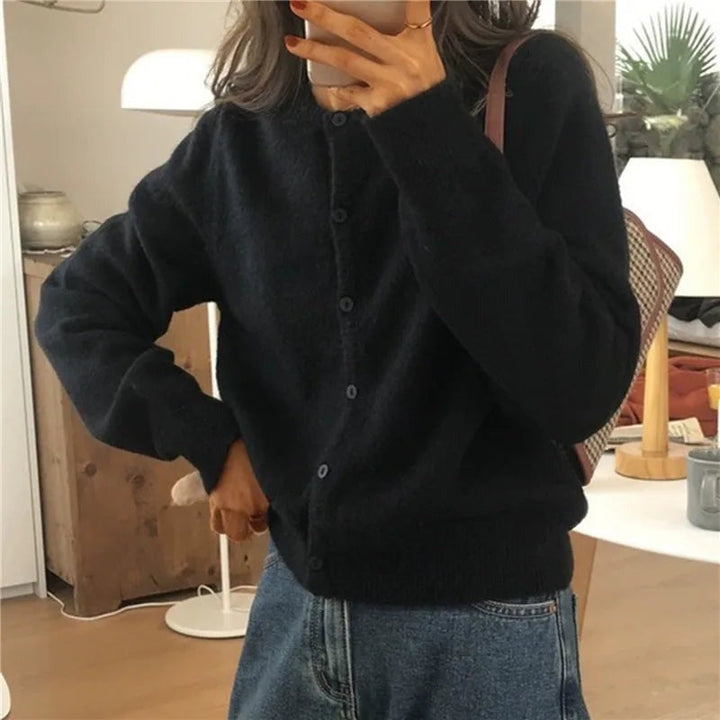 Soft knit button cardigan in black, worn, front view