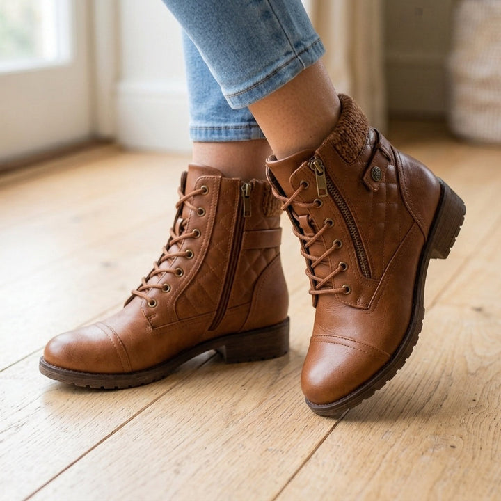 Brown quilted lace-up ankle boots worn with jeans