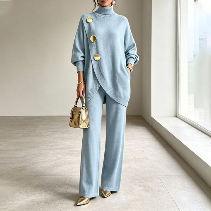 Sky blue knitted co-ord set with gold-button turtleneck wrap jumper and wide-leg trousers, worn, front view