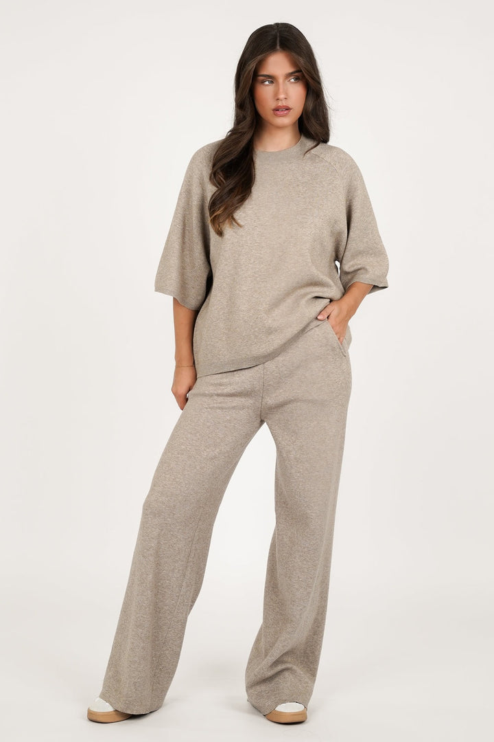 Taupe knitted short-sleeve lounge set, front view, hand in the pocket