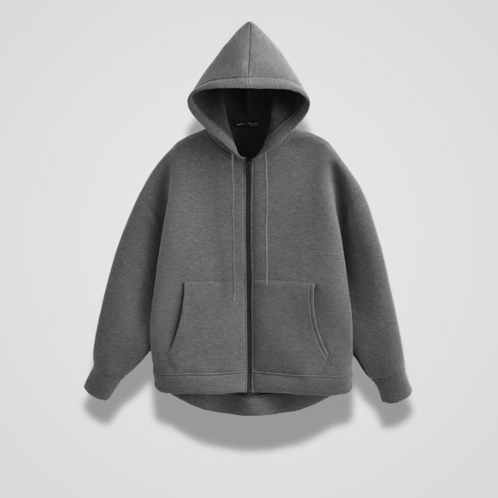 Dark grey oversized zip-up hoodie with a hood, drawcords and two pockets, front view | Grace Aura