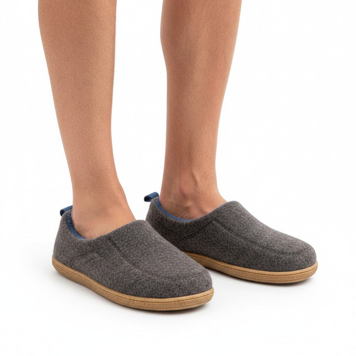 Dark grey slippers worn