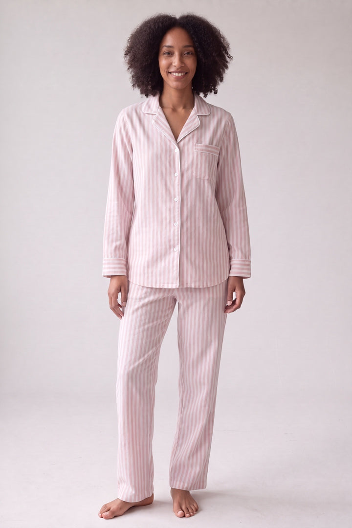 Pink striped cotton flannel pyjamas with button-up shirt and drawstring trousers, worn, front view