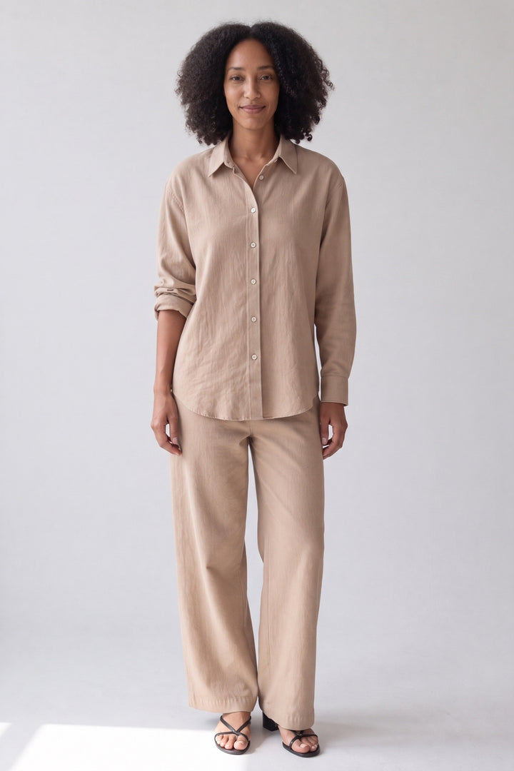 Button-up shirt and wide-leg trousers in nude, worn, full-length front view