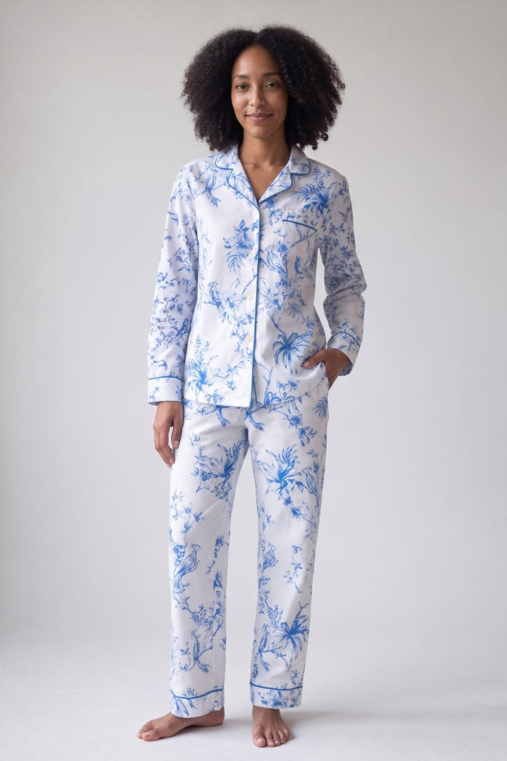 White flannel pyjamas with a blue bird and flower print, worn, front view
