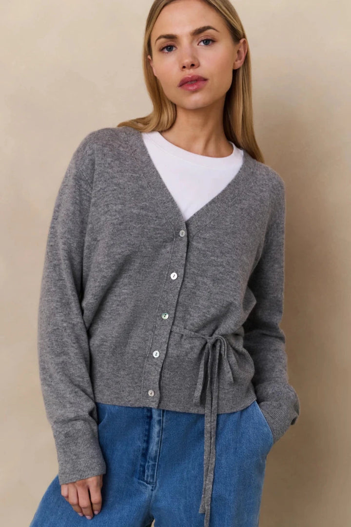 Gray knit button-up cardigan with tie waist, worn by model | Grace Aura