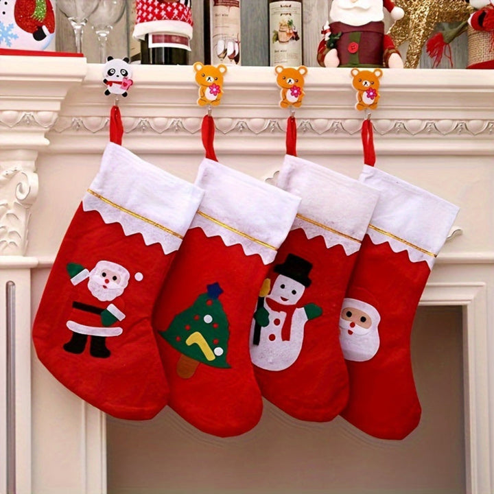 Four red felt Christmas stockings with Santa, tree, and snowman designs hanging | Grace Aura