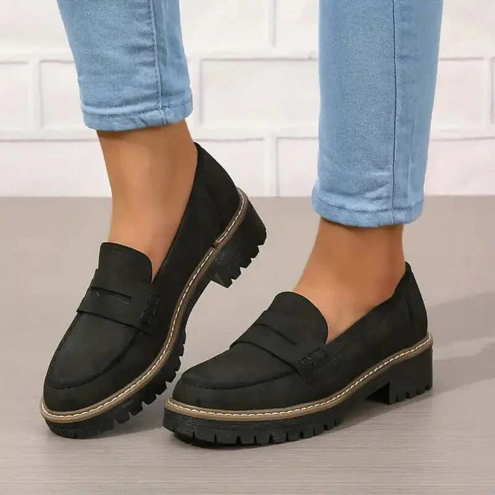 Black chunky suede penny loafers worn by person with cropped jeans | Grace Aura