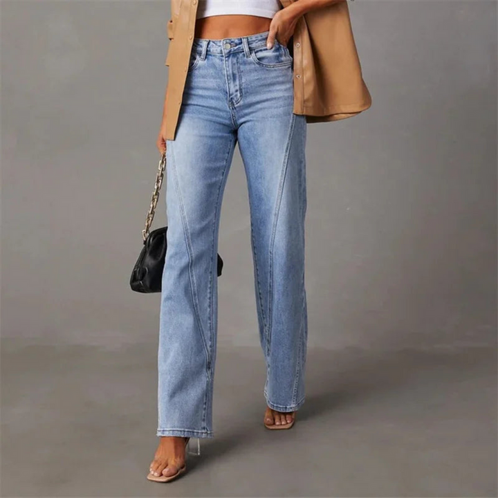 Light blue high-waisted flared denim jeans worn by a woman, front view | Grace Aura