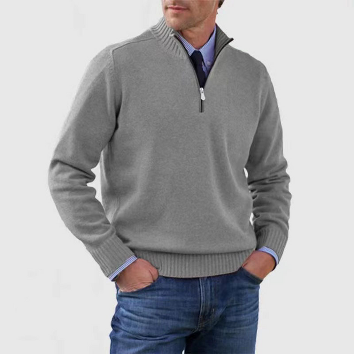 Man wearing gray quarter-zip knit sweater with blue collared shirt underneath | Grace Aura