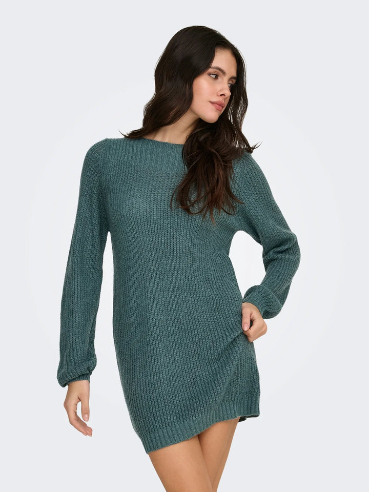 Woman wearing teal ribbed knit long-sleeve mini sweater dress | Grace Aura
