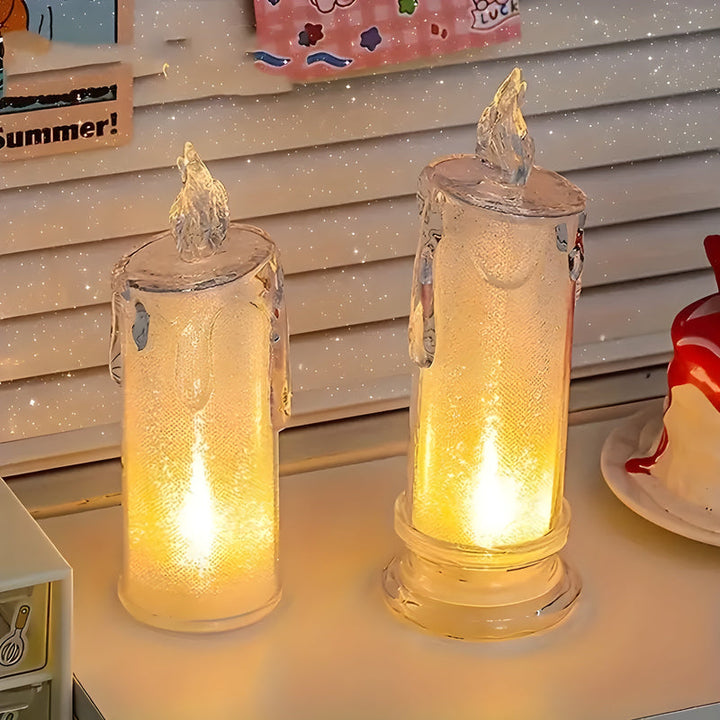 Two flameless LED pillar candles with textured glass, glowing warm light, flickering flame tops | Grace Aura