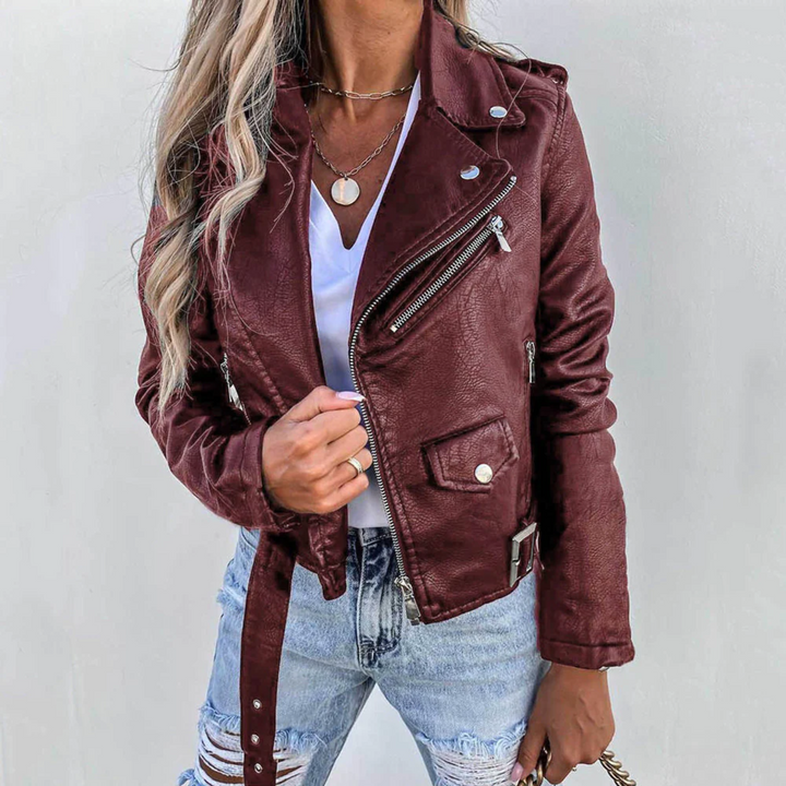 Burgundy faux leather belted biker jacket worn by woman with layered necklaces | Grace Aura