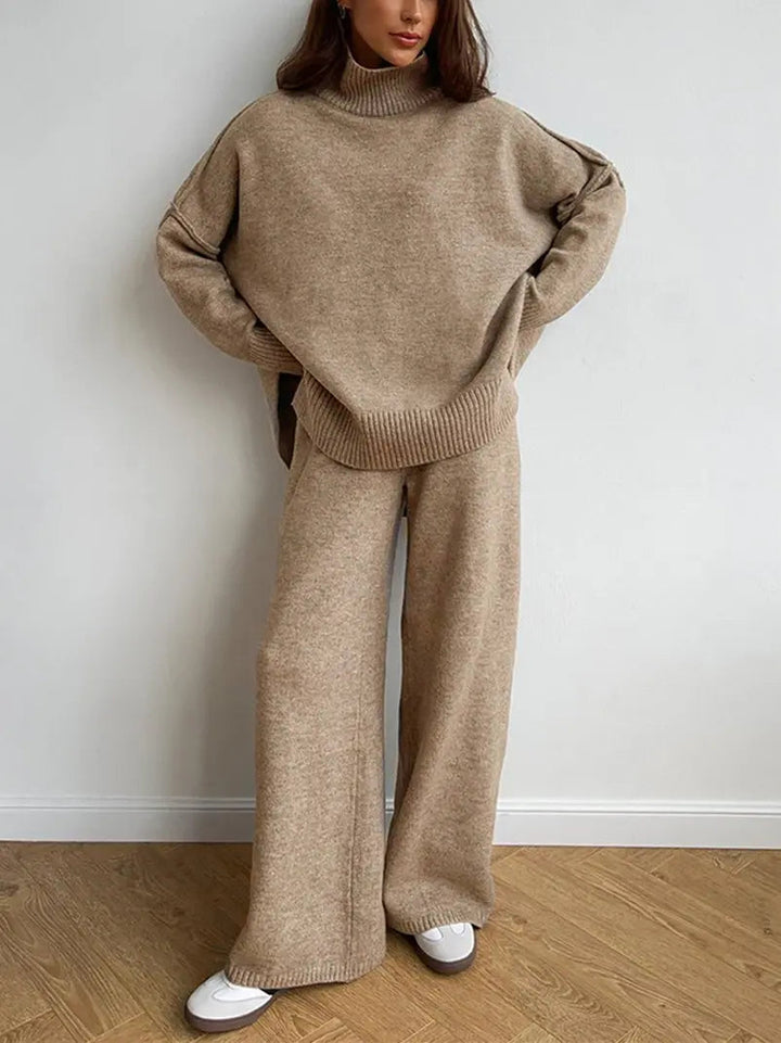 Woman wearing beige oversized turtleneck sweater and matching wide leg knit pants | Grace Aura
