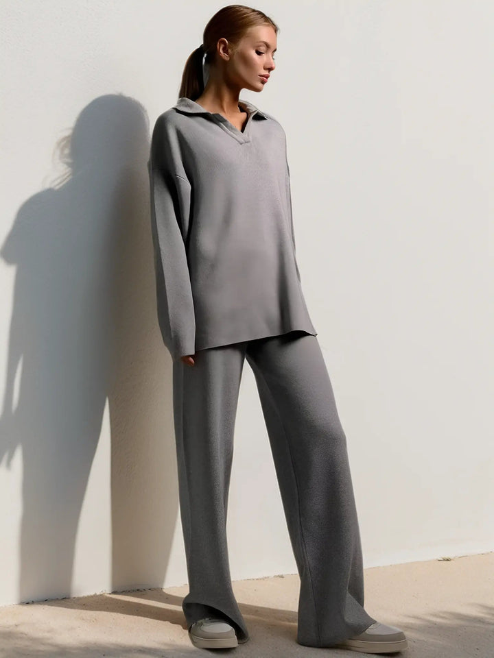 Woman wearing grey knit hooded top and matching wide-leg trousers | Grace Aura