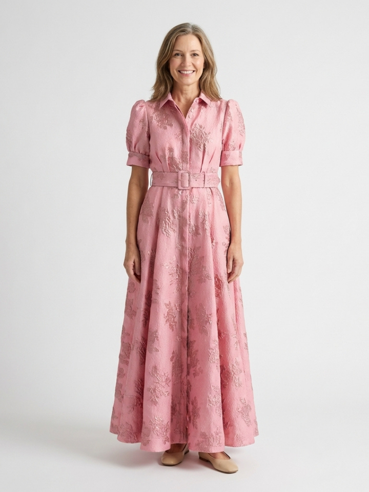 Woman wearing pink floral belted maxi dress with puff sleeves, button-up front | Grace Aura