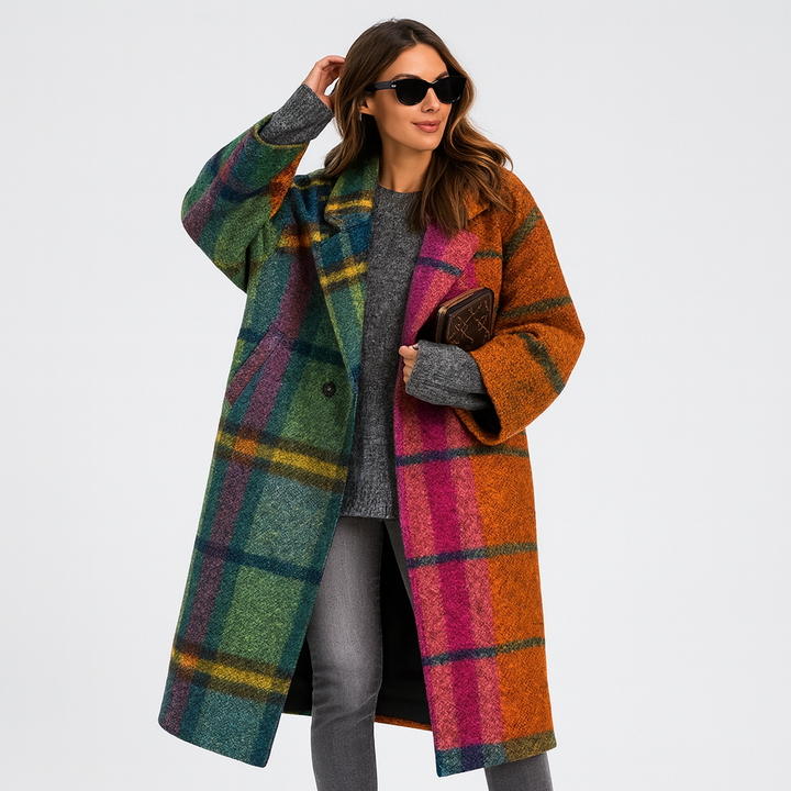 Woman wearing oversized multicolor plaid wool coat with contrasting green and orange panels | Grace Aura