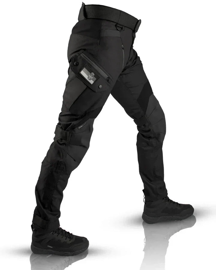 Black tactical cargo pants with leg pockets worn by person, boots visible | Grace Aura