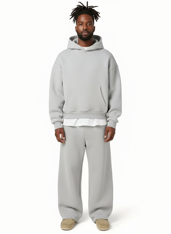 Man wearing gray hooded sweatshirt and matching jogger pants outfit | Grace Aura