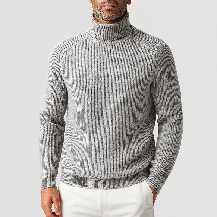 Gray ribbed knit turtleneck sweater worn by man with white pants | Grace Aura