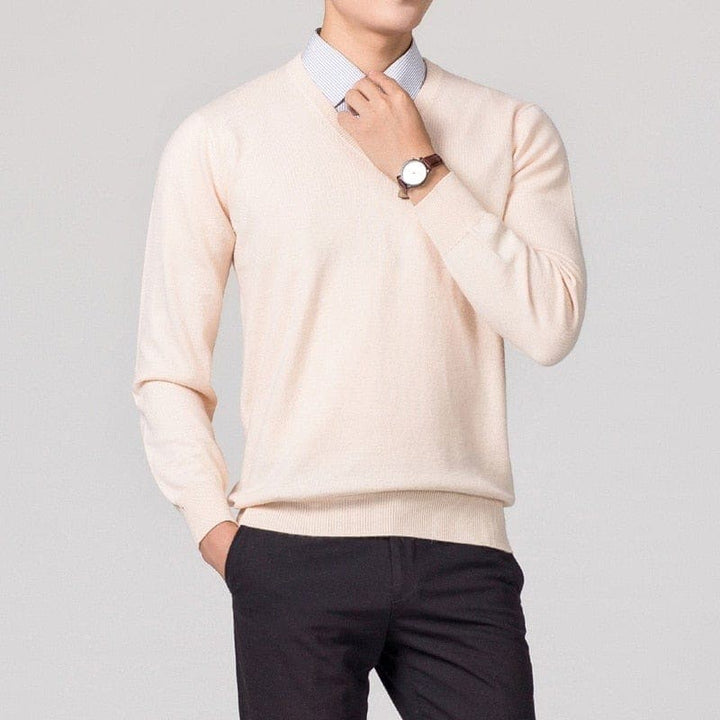 Man wearing cream V-neck knitted sweater with collared shirt and watch | Grace Aura