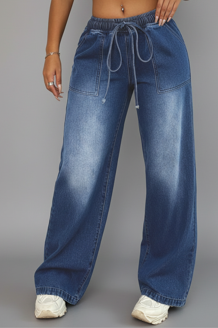 Blue denim wide-leg jeans with drawstring waist, worn by model | Grace Aura