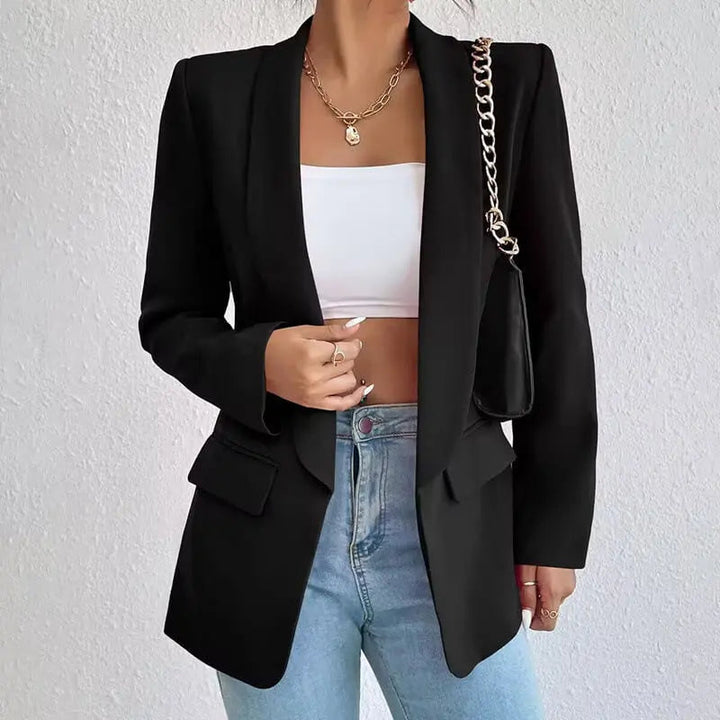 Black open-front blazer worn by woman with white crop top, jeans | Grace Aura