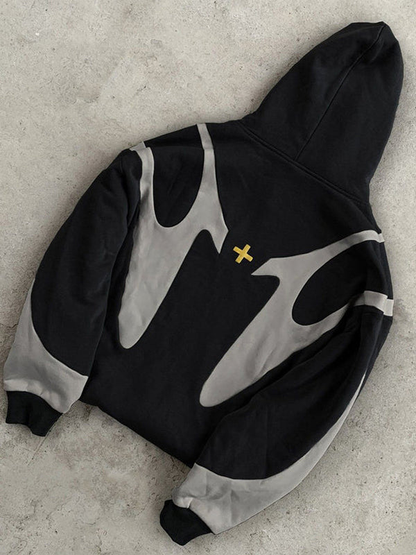 Black and gray zip-up hoodie with abstract pattern, laid flat | Grace Aura