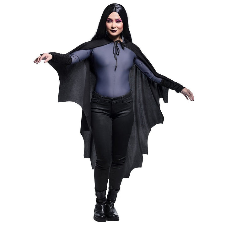 Woman wearing the black bat wing cape with arms spread, front view