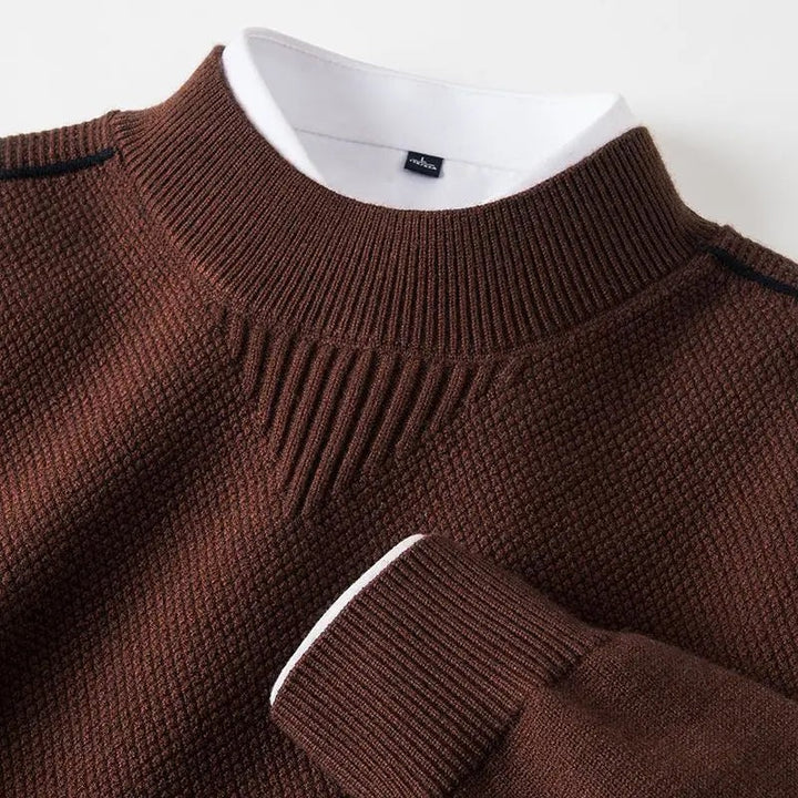 Close view of the brown textured knit jumper with a ribbed crew neck and a contrast cuff
