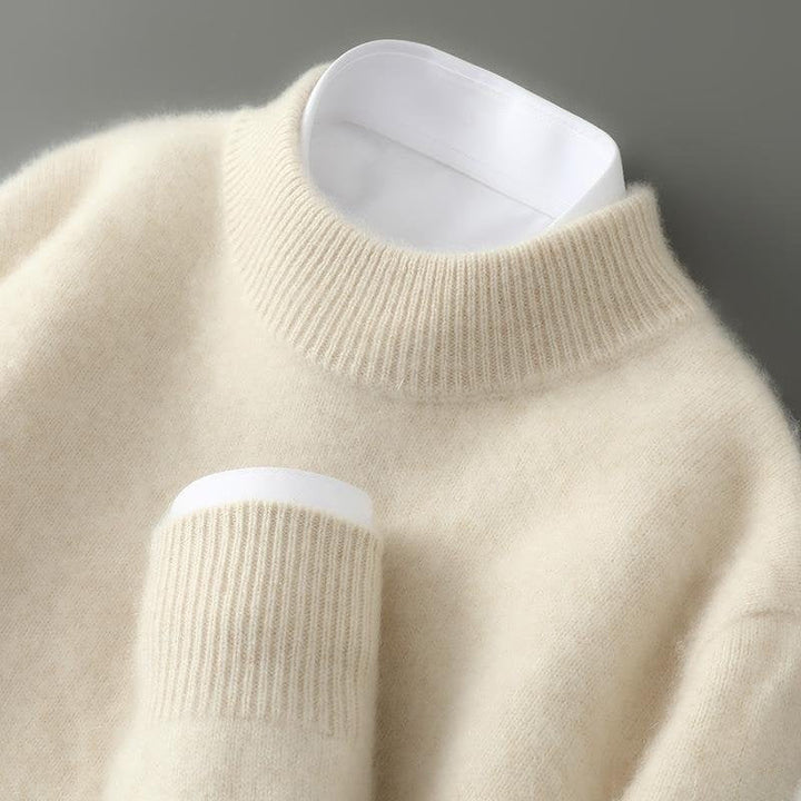 Cream mock neck jumper with ribbed cuffs and collar, close-up worn detail | Grace Aura