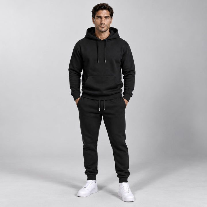 Man wearing black hooded tracksuit with pullover hoodie and jogger pants | Grace Aura