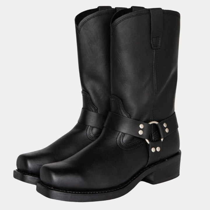 Black square-toe harness boots with buckle straps, shown standing as a pair | Grace Aura
