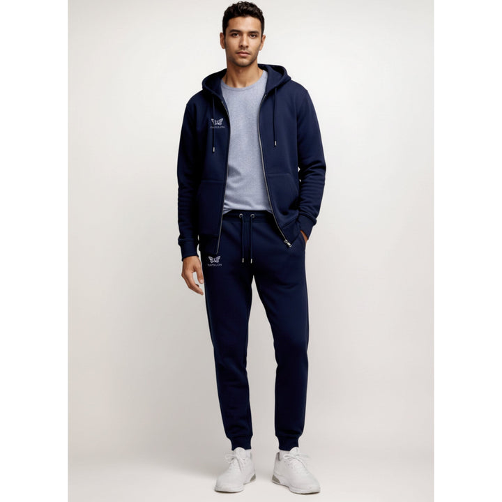 Man in a navy zip hoodie and joggers tracksuit, front view