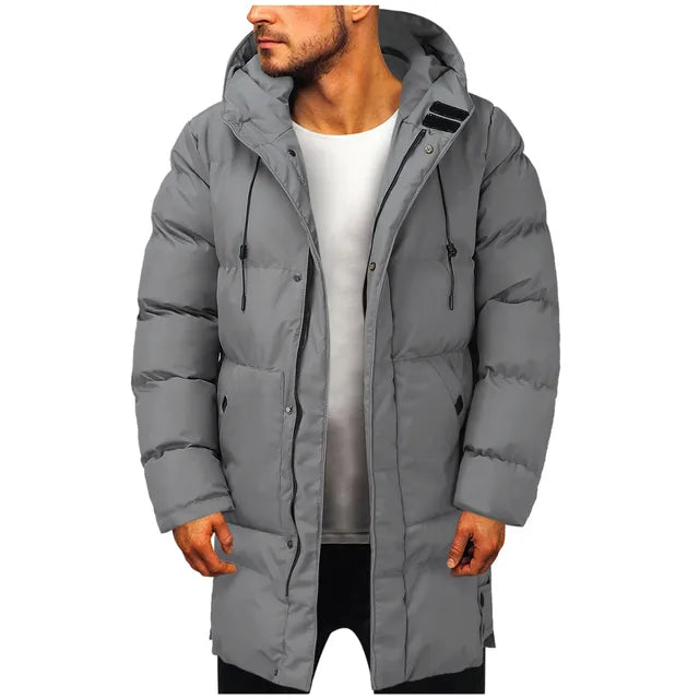 Gray hooded padded longline puffer jacket worn by a man, front view | Grace Aura