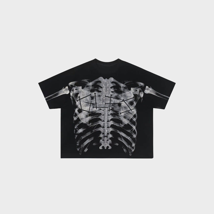 Black oversized t-shirt with ribcage x-ray print, shown flat on background | Grace Aura