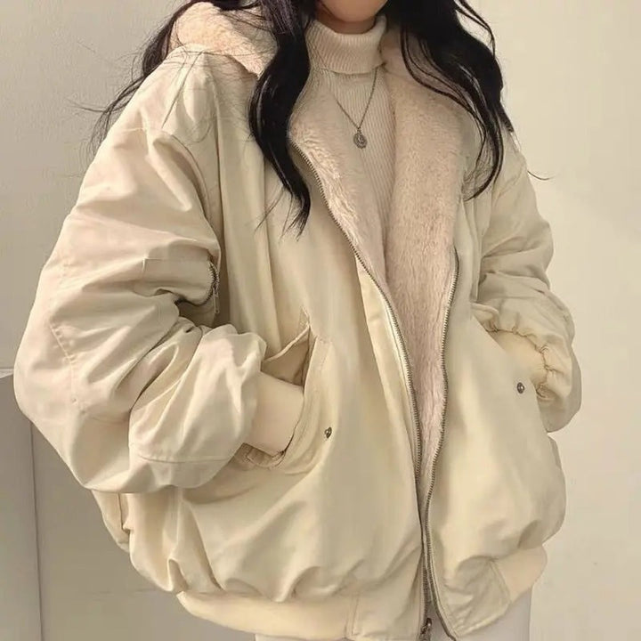 Cream bomber jacket with fleece lining and hood, worn by woman | Grace Aura