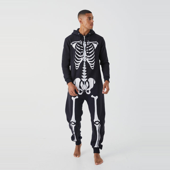Man wearing black hooded skeleton onesie with white bone print, front view | Grace Aura