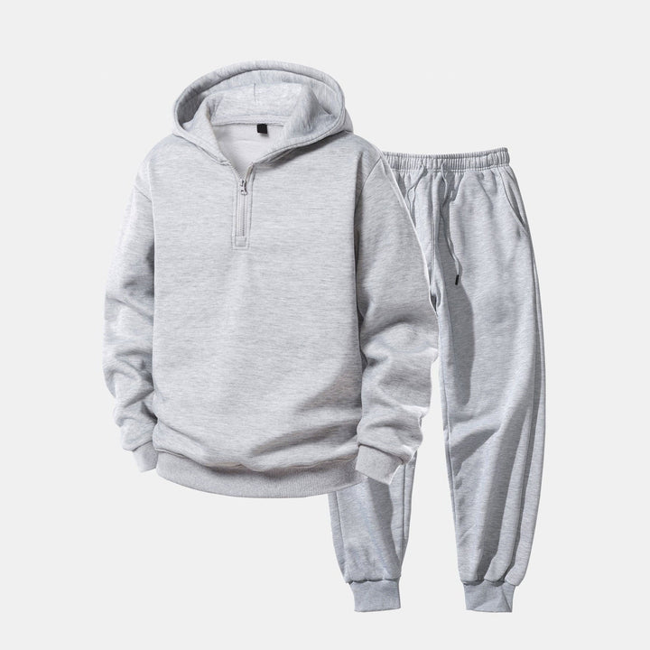 Gray quarter-zip hoodie and matching cuffed joggers, flat lay tracksuit set | Grace Aura
