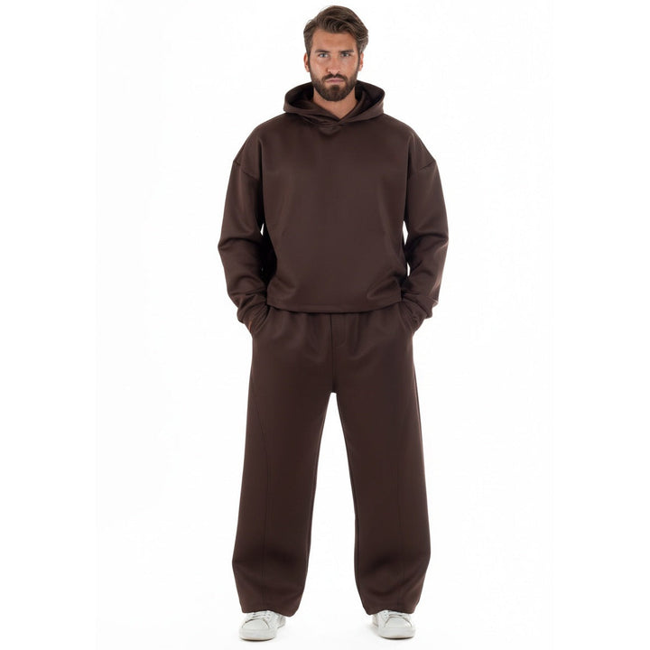 Man wearing brown oversized hoodie and matching baggy sweatpants, white sneakers | Grace Aura