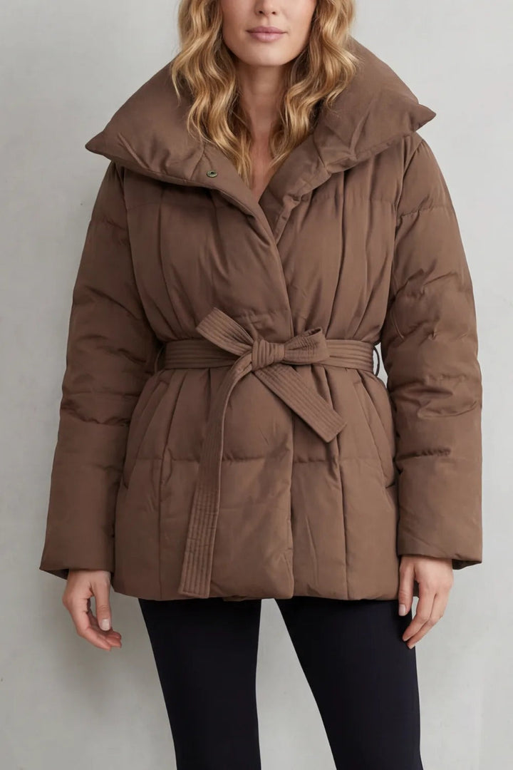 Brown oversized puffer jacket for women with a large collar and tie belt